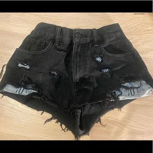 Black jean shorts, fits like a small/medium more on the medium size.